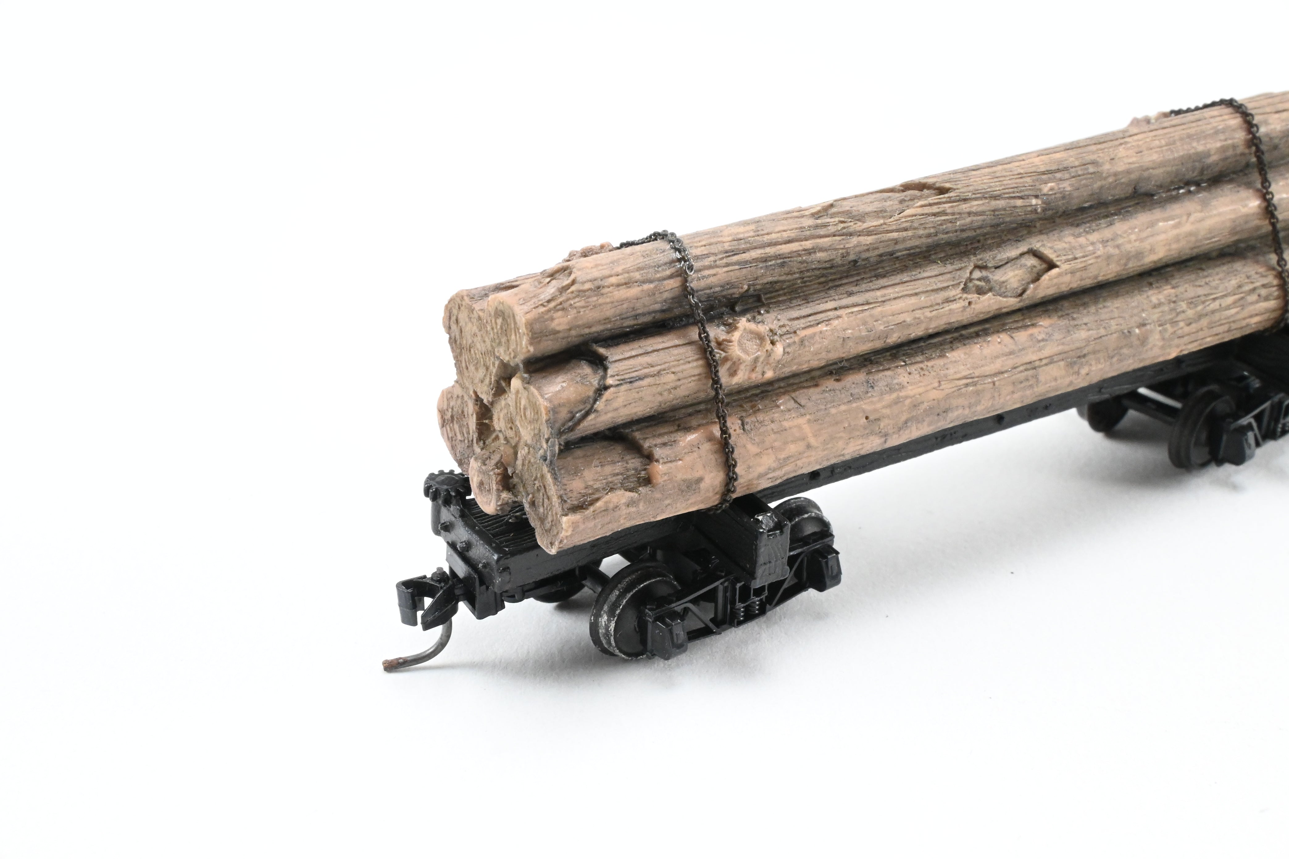 HOn3 Micro-Trains 30’ Factory-Painted Unlettered Skeleton Log Car with Load