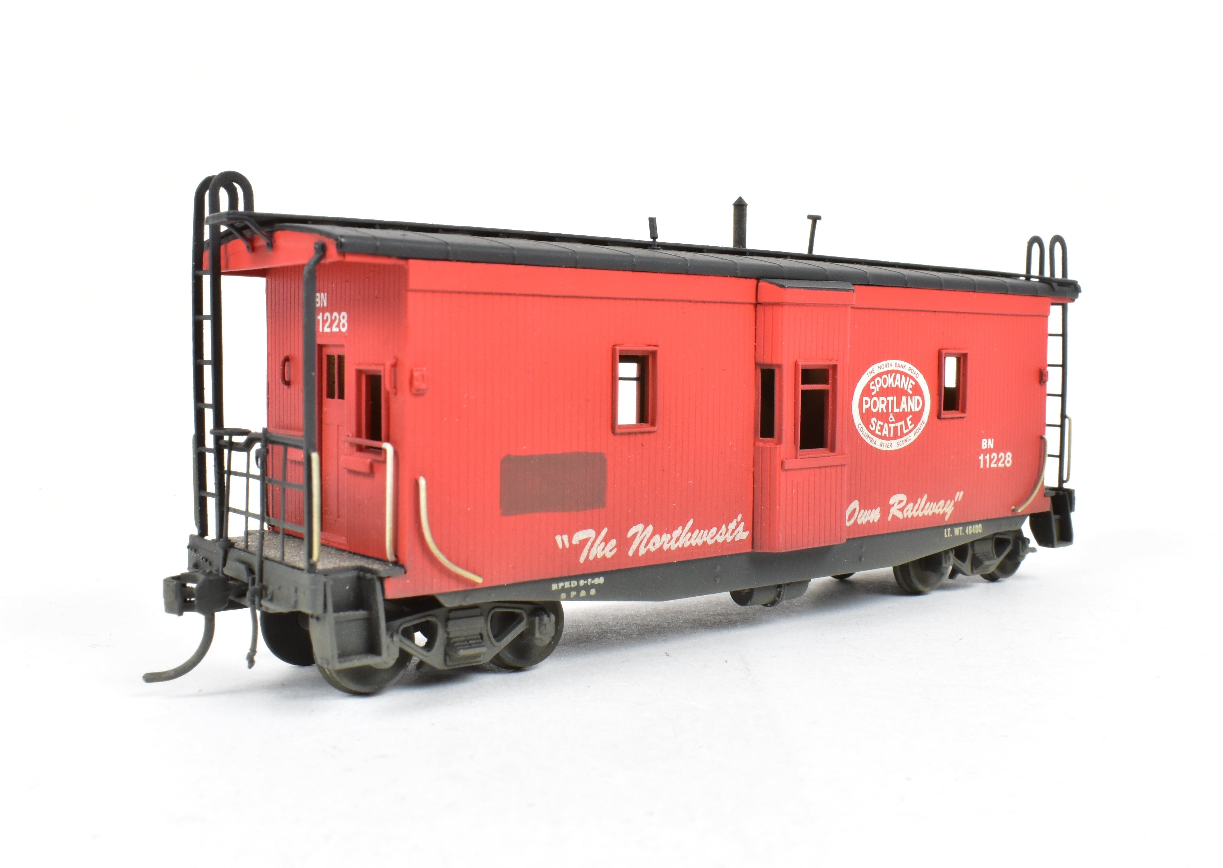 HO Scale Brass OMI - Overland Models, Inc. Model Train Spokane Portland & Seattle Wood Bay Window Caboose with Burlington Northern #11228 Design