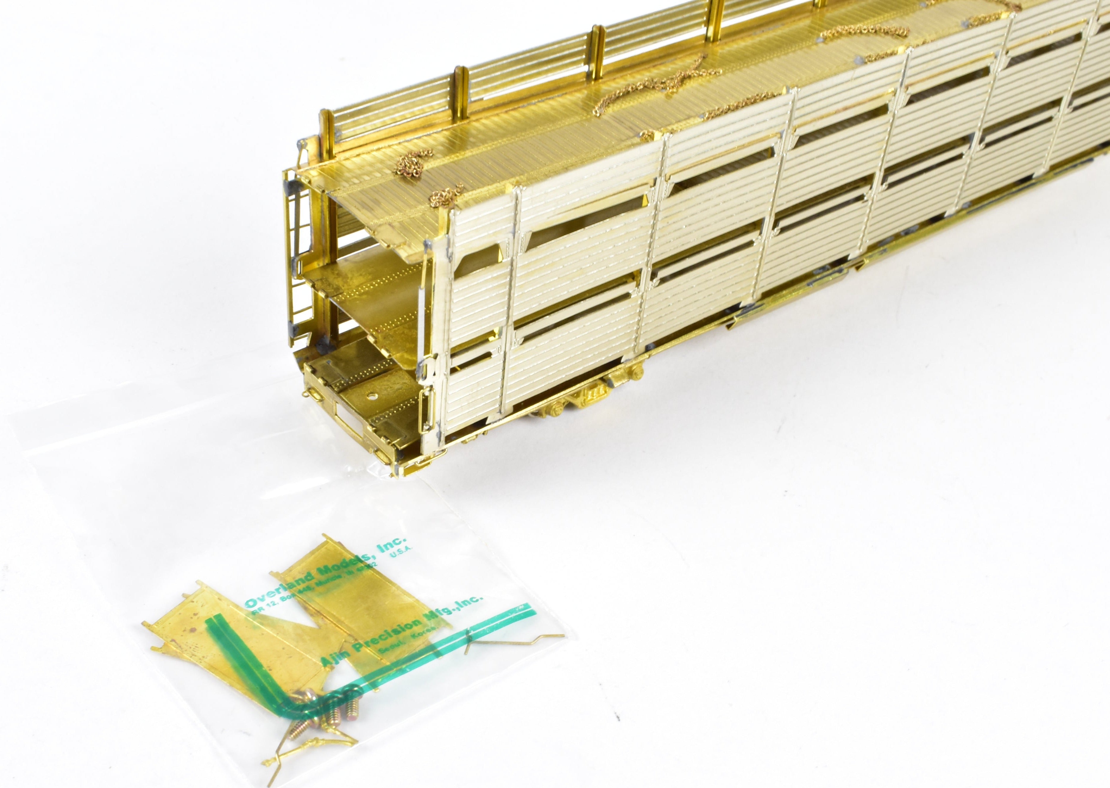 HO Scale Brass Tri - Level Auto Rack Model by Overland Models, Inc. (OMI) for Various Railroads like ATSF, BN, CR, N&W, and SP with Pressed Sides and Optional Roof