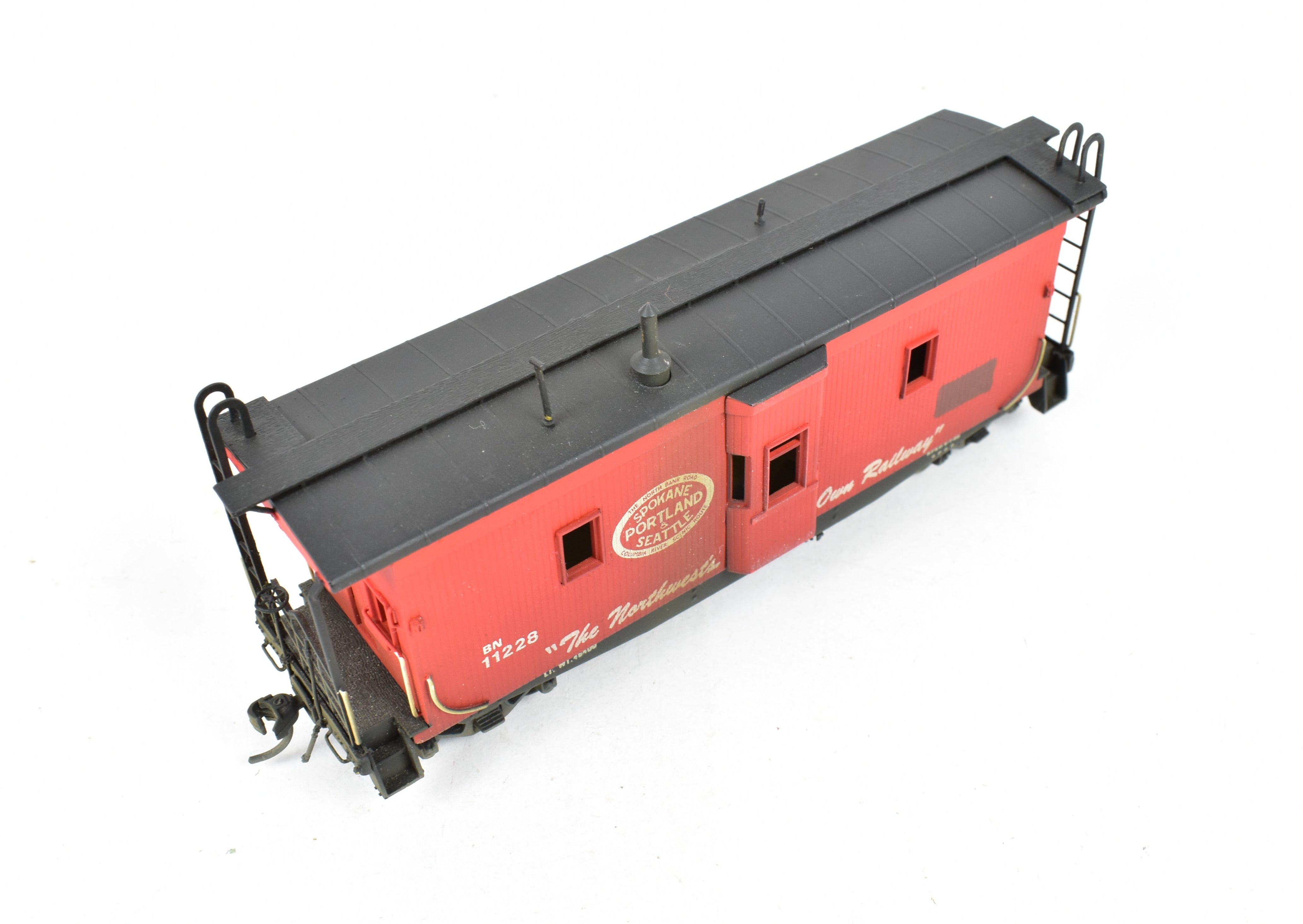 HO Scale Brass OMI - Overland Models, Inc. Model Train Spokane Portland & Seattle Wood Bay Window Caboose with Burlington Northern #11228 Design