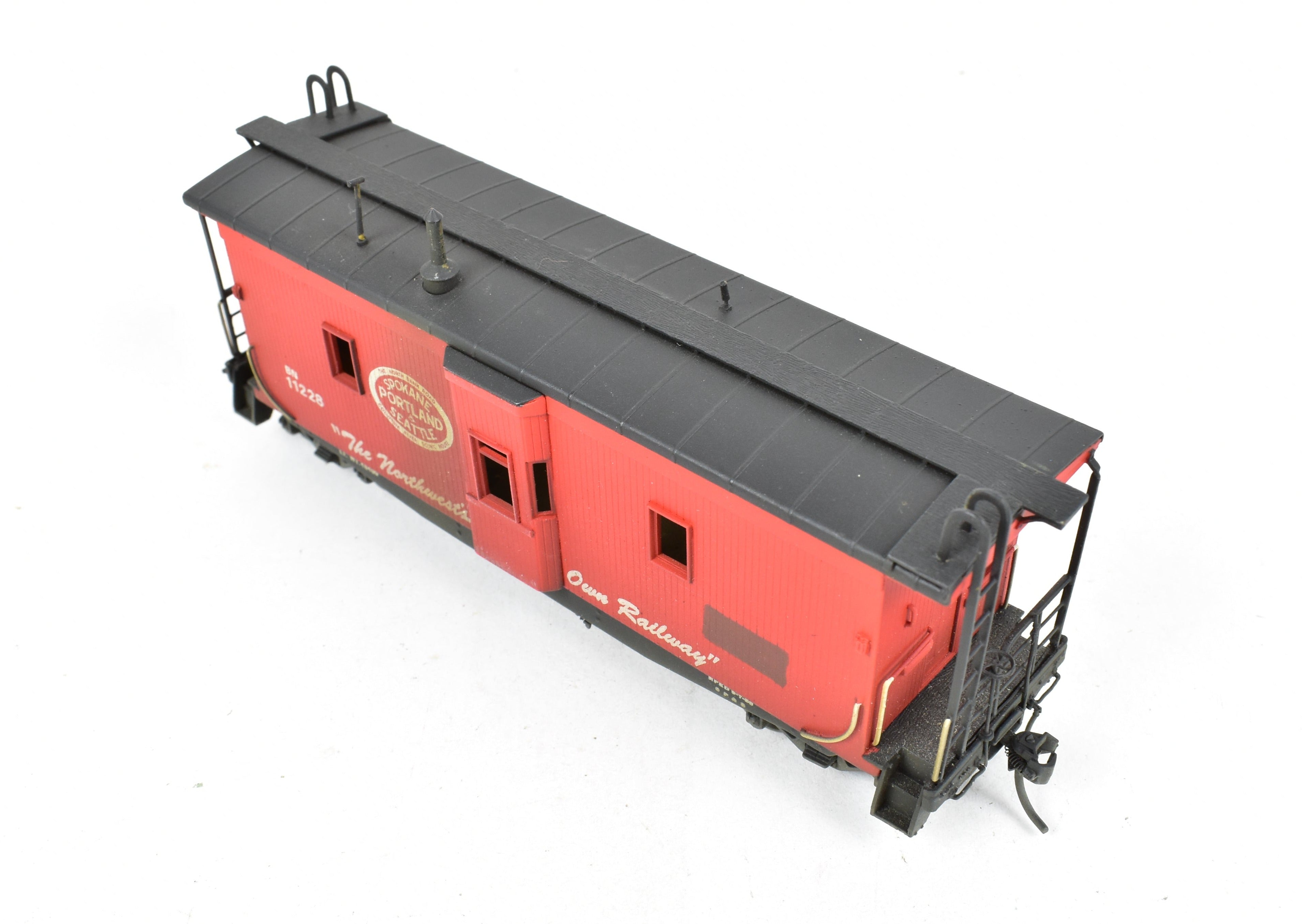 HO Scale Brass OMI - Overland Models, Inc. Model Train Spokane Portland & Seattle Wood Bay Window Caboose with Burlington Northern #11228 Design