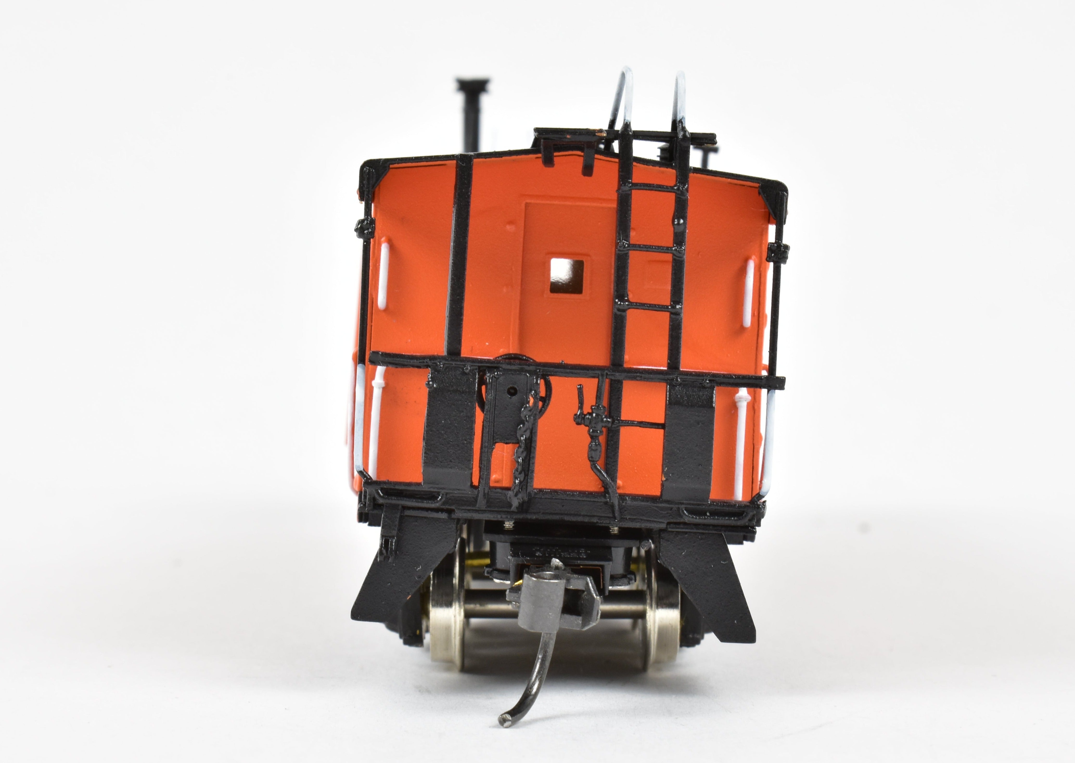 HO Scale Brass Model of Overland Models, Inc. Milwaukee Road Bay Window Caboose with Drop Center Trucks, CP No. 992016