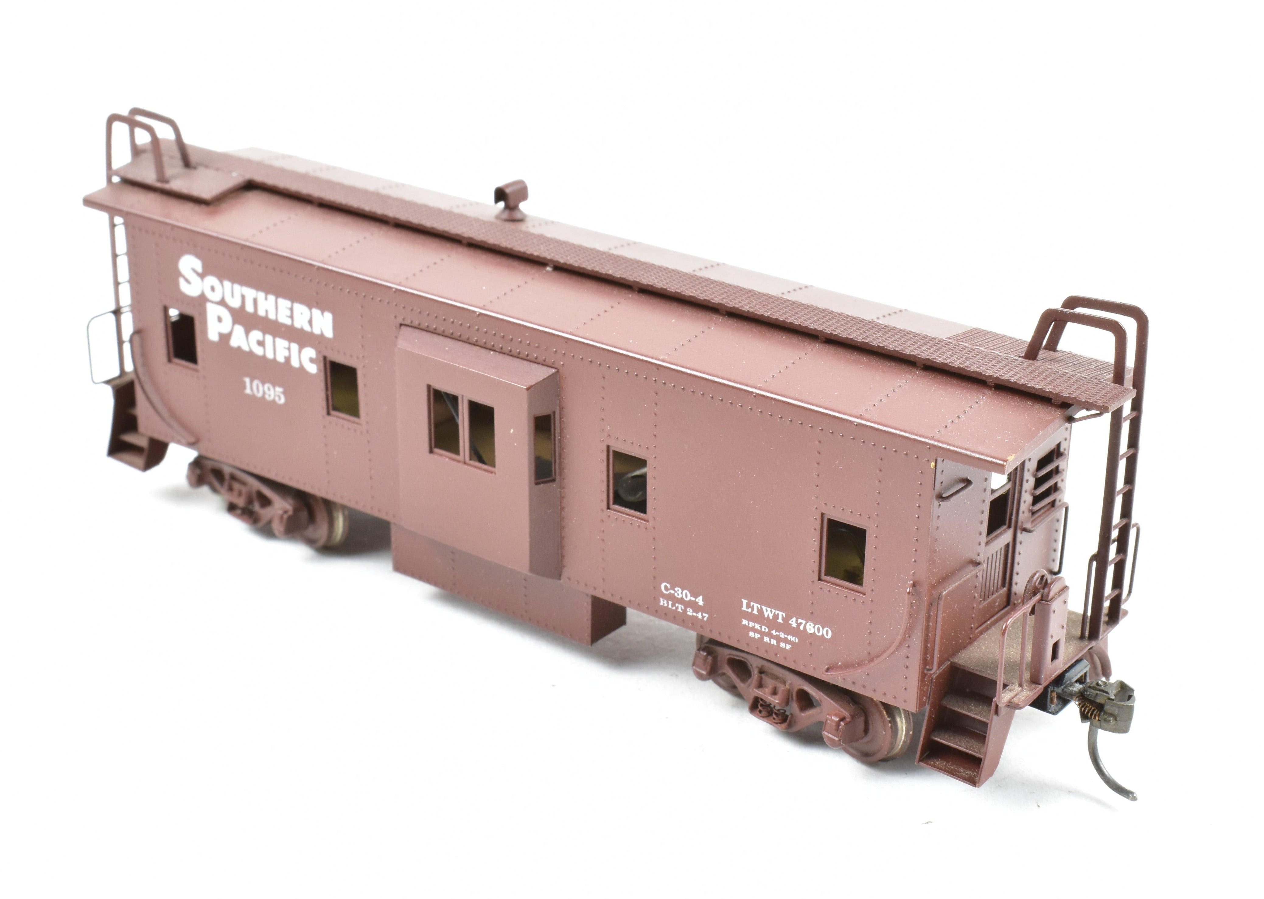 High - Quality HO Scale Brass Custom - Painted Southern Pacific Bay Window Caboose Model by Trains Inc.