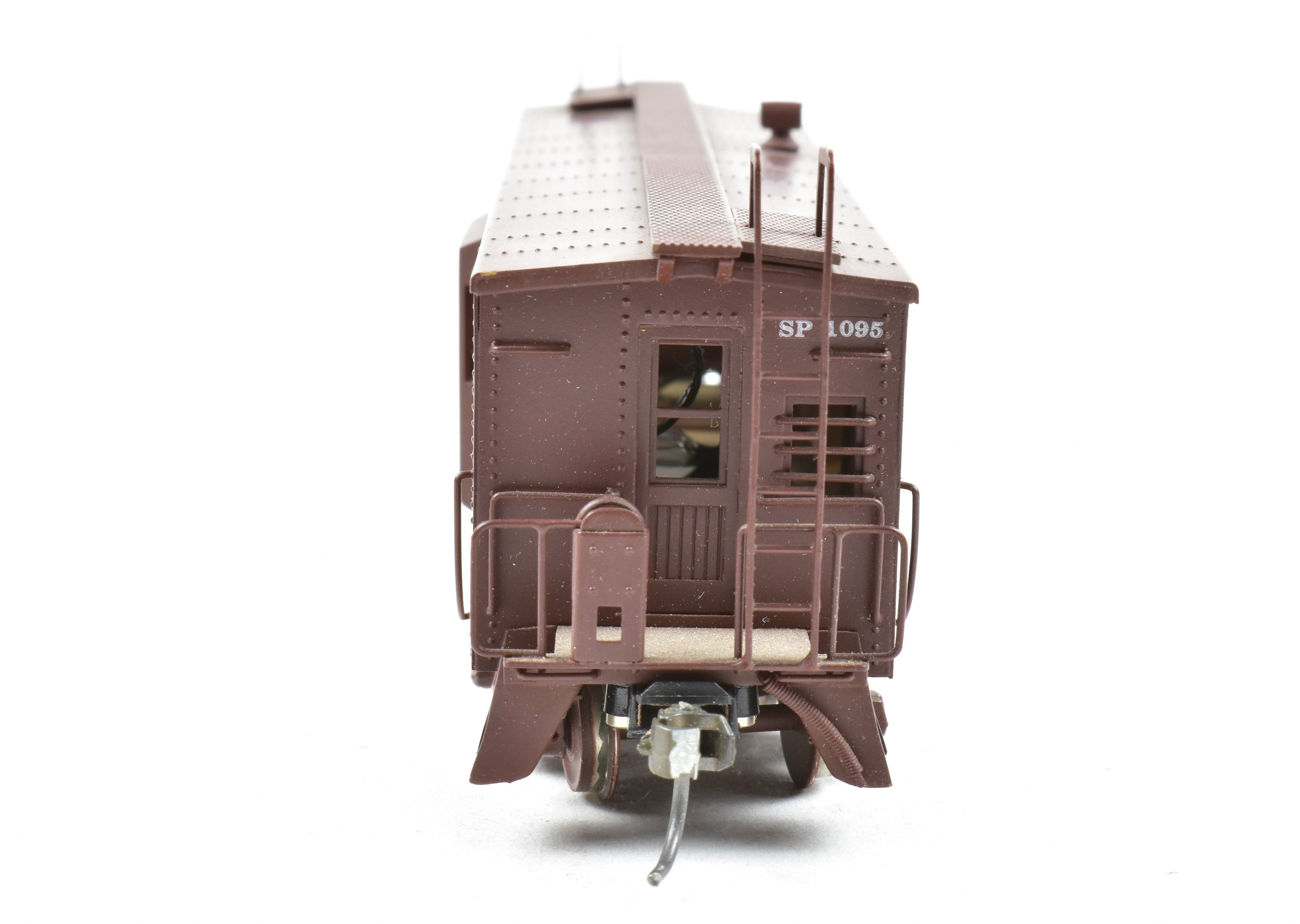 High - Quality HO Scale Brass Custom - Painted Southern Pacific Bay Window Caboose Model by Trains Inc.