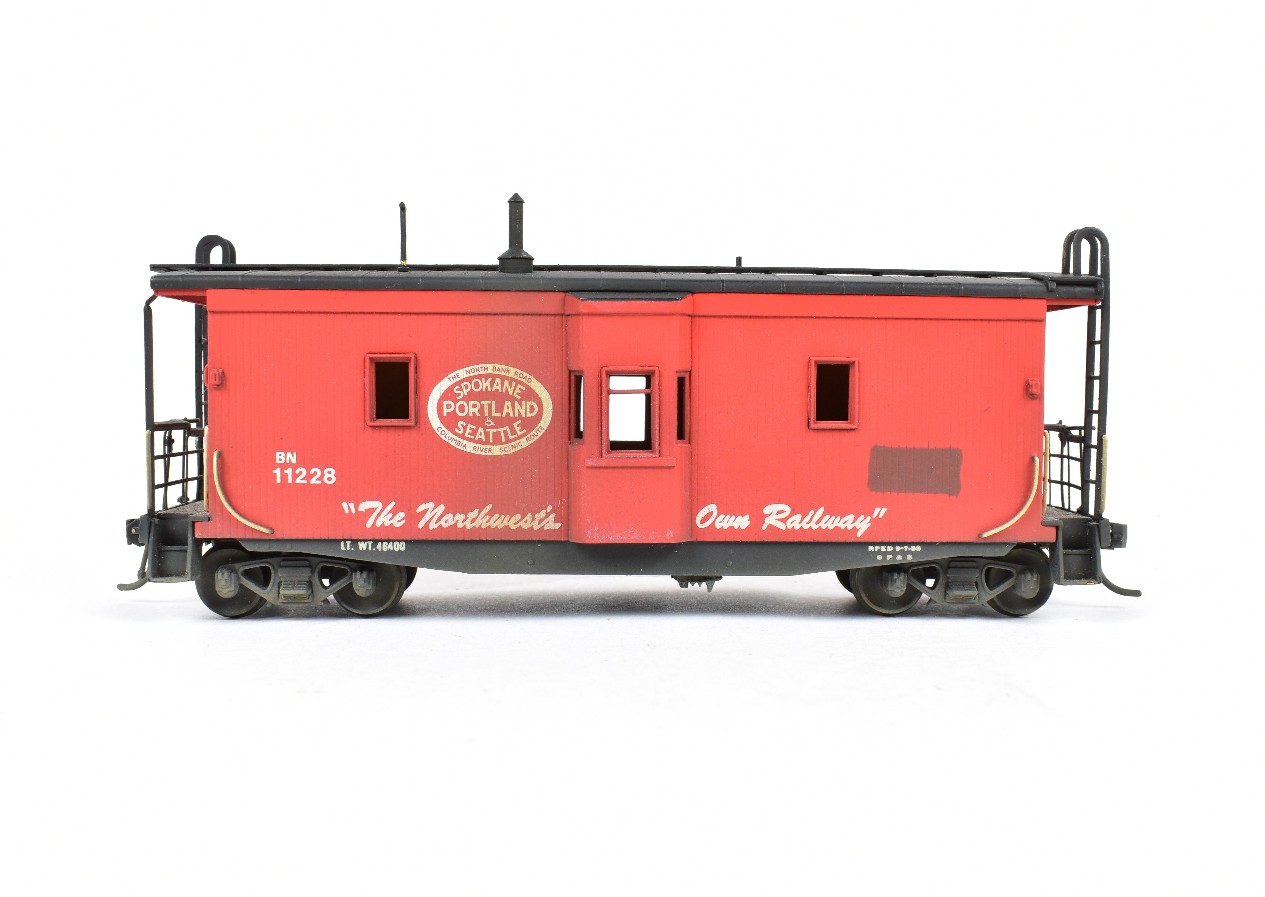 HO Scale Brass OMI - Overland Models, Inc. Model Train Spokane Portland & Seattle Wood Bay Window Caboose with Burlington Northern #11228 Design
