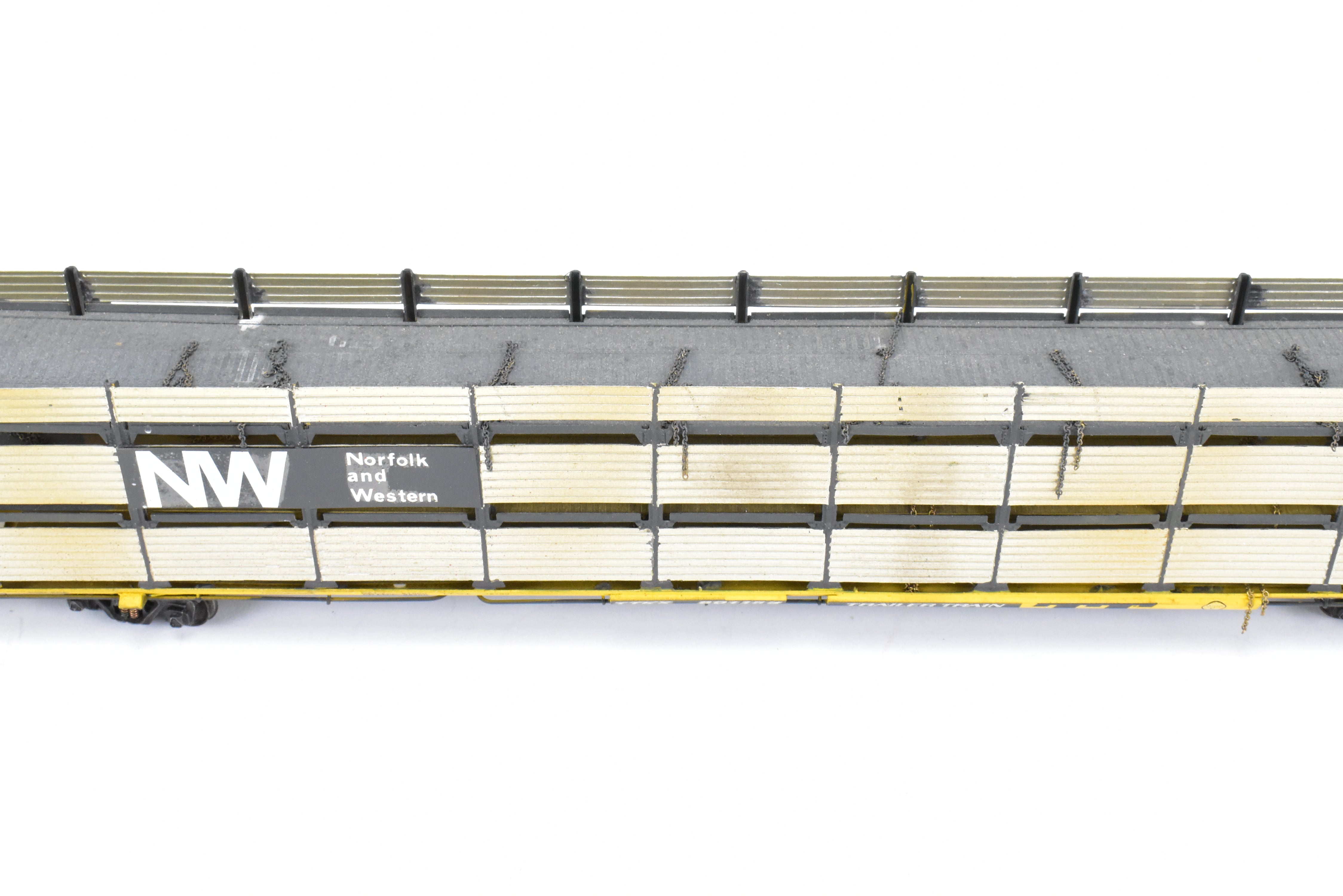 HO Scale Brass Model Tri-Level Auto Rack by Overland Models, Inc. (OMI) - Norfolk & Western Design with Pressed Sides, No Roof, C/P TTKX, and Lightly Weathered Appearance