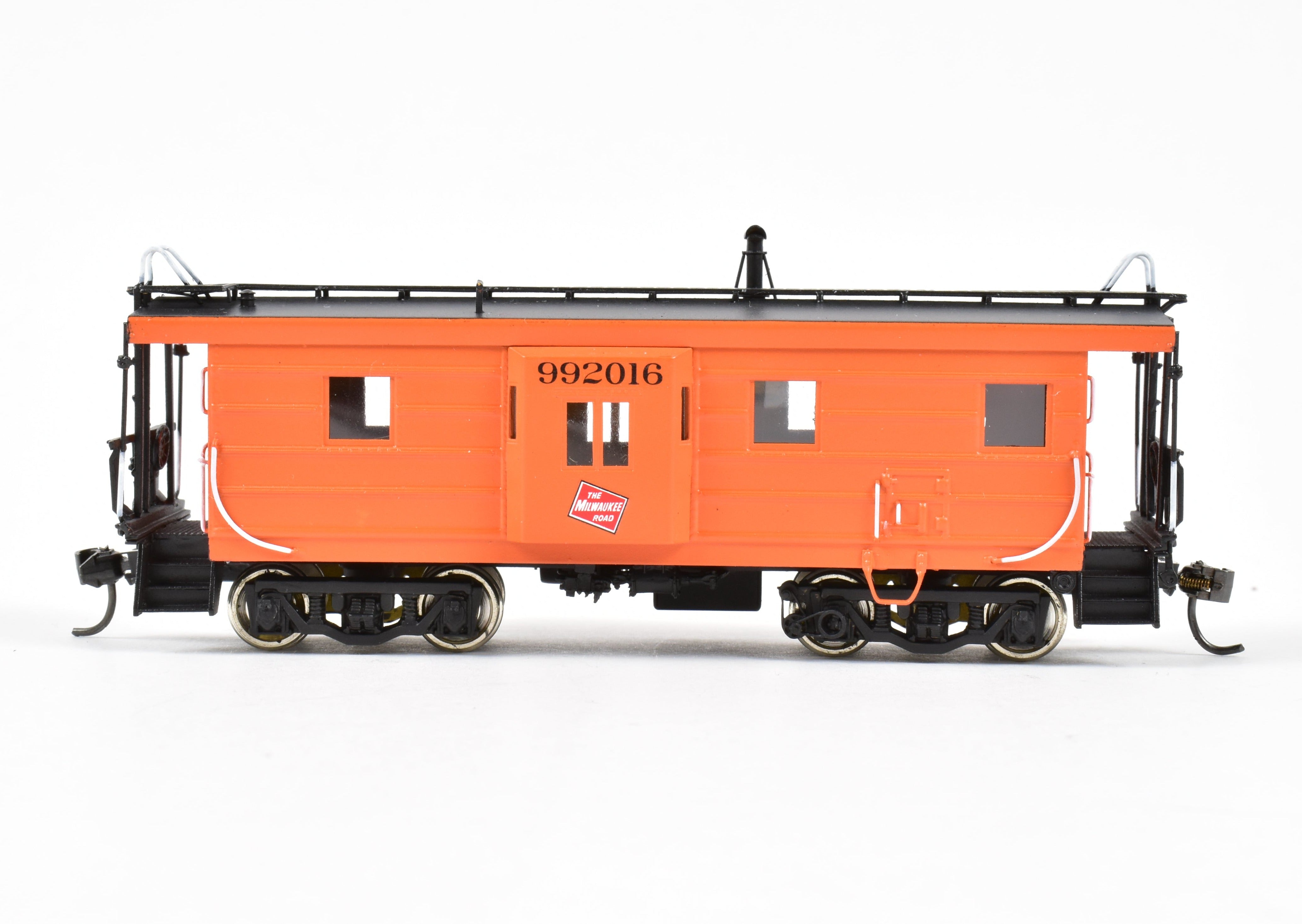 HO Scale Brass Model of Overland Models, Inc. Milwaukee Road Bay Window Caboose with Drop Center Trucks, CP No. 992016