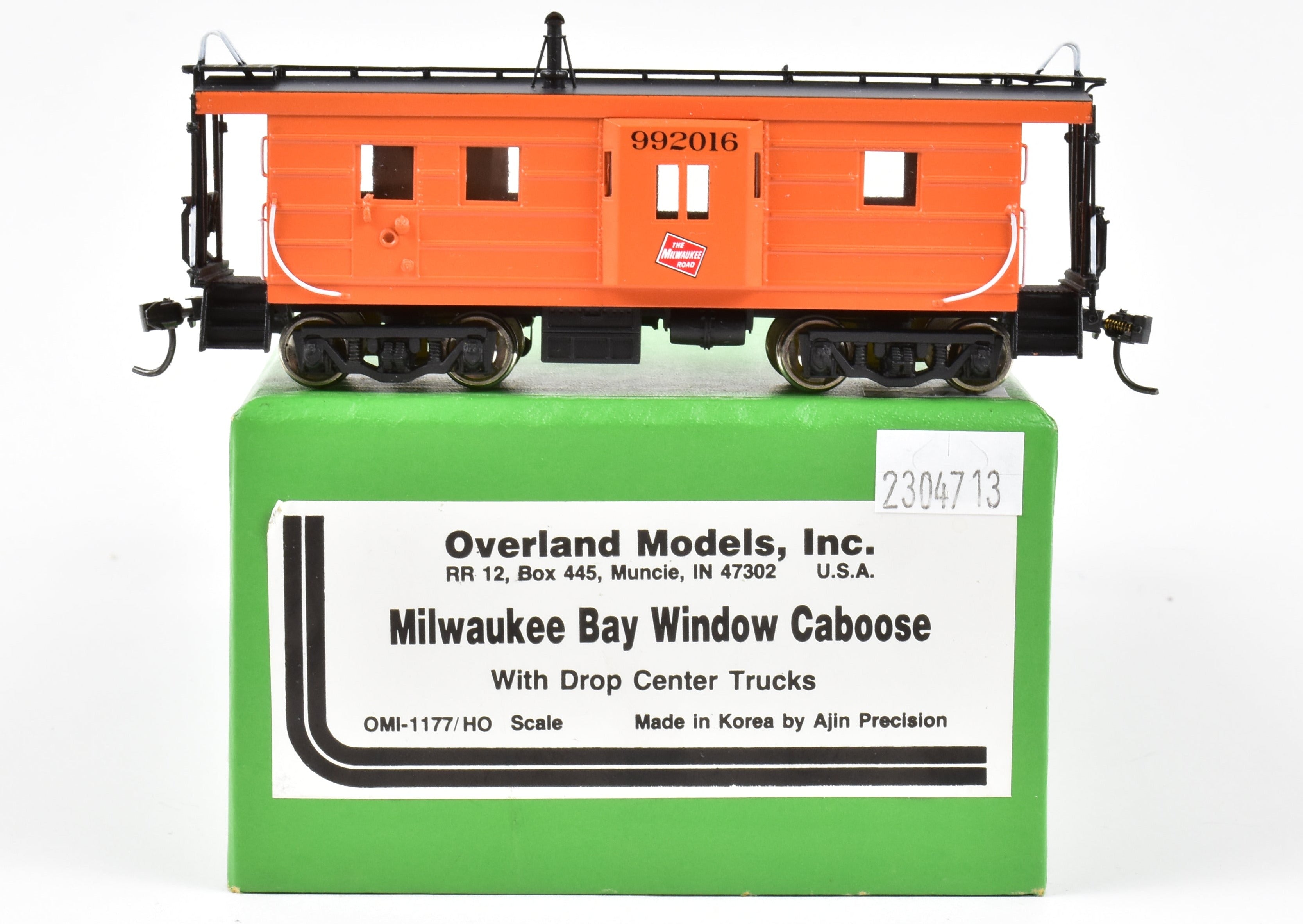 HO Scale Brass Model of Overland Models, Inc. Milwaukee Road Bay Window Caboose with Drop Center Trucks, CP No. 992016