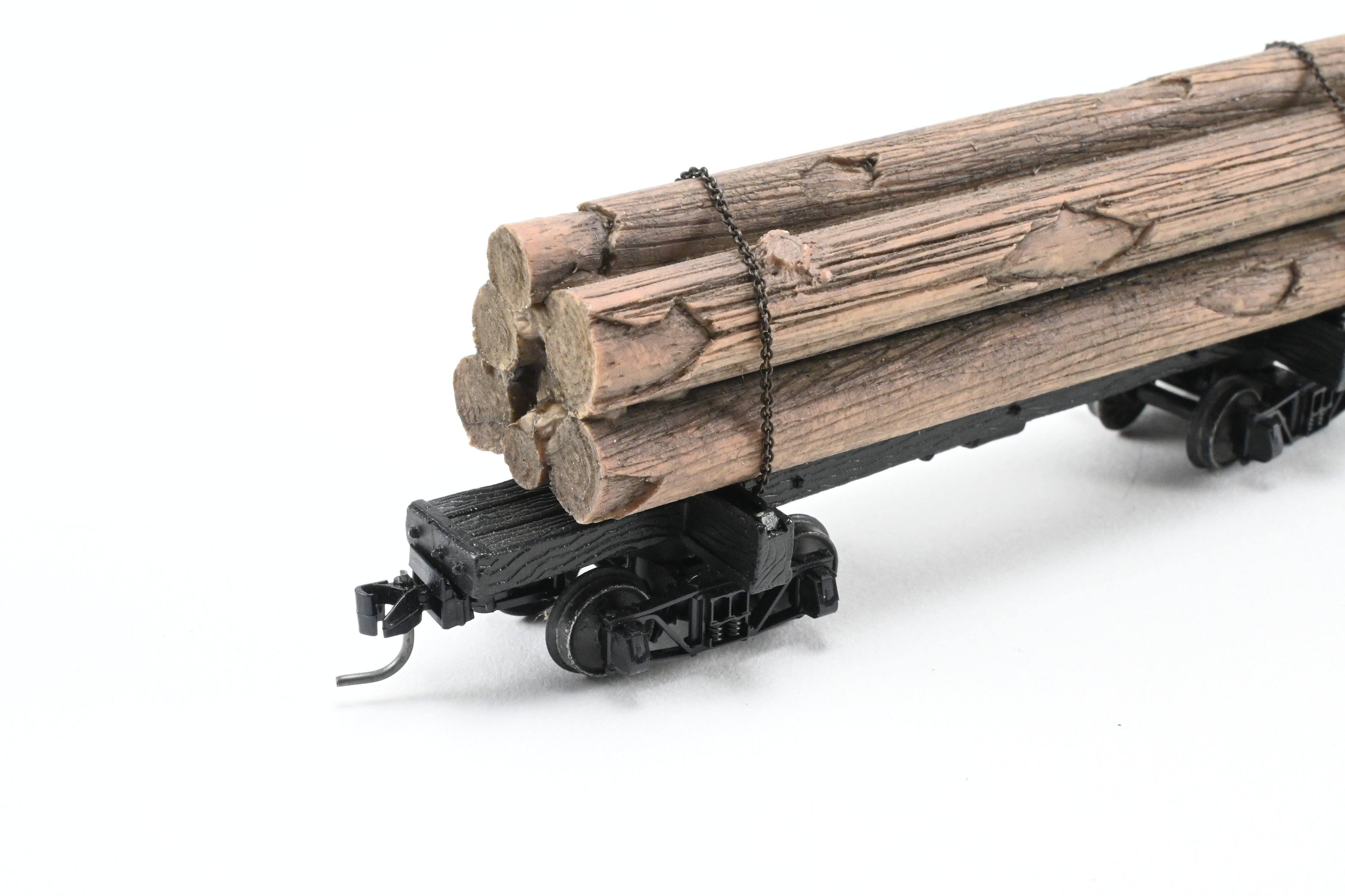 HOn3 Micro-Trains 30’ Factory-Painted Unlettered Skeleton Log Car with Load