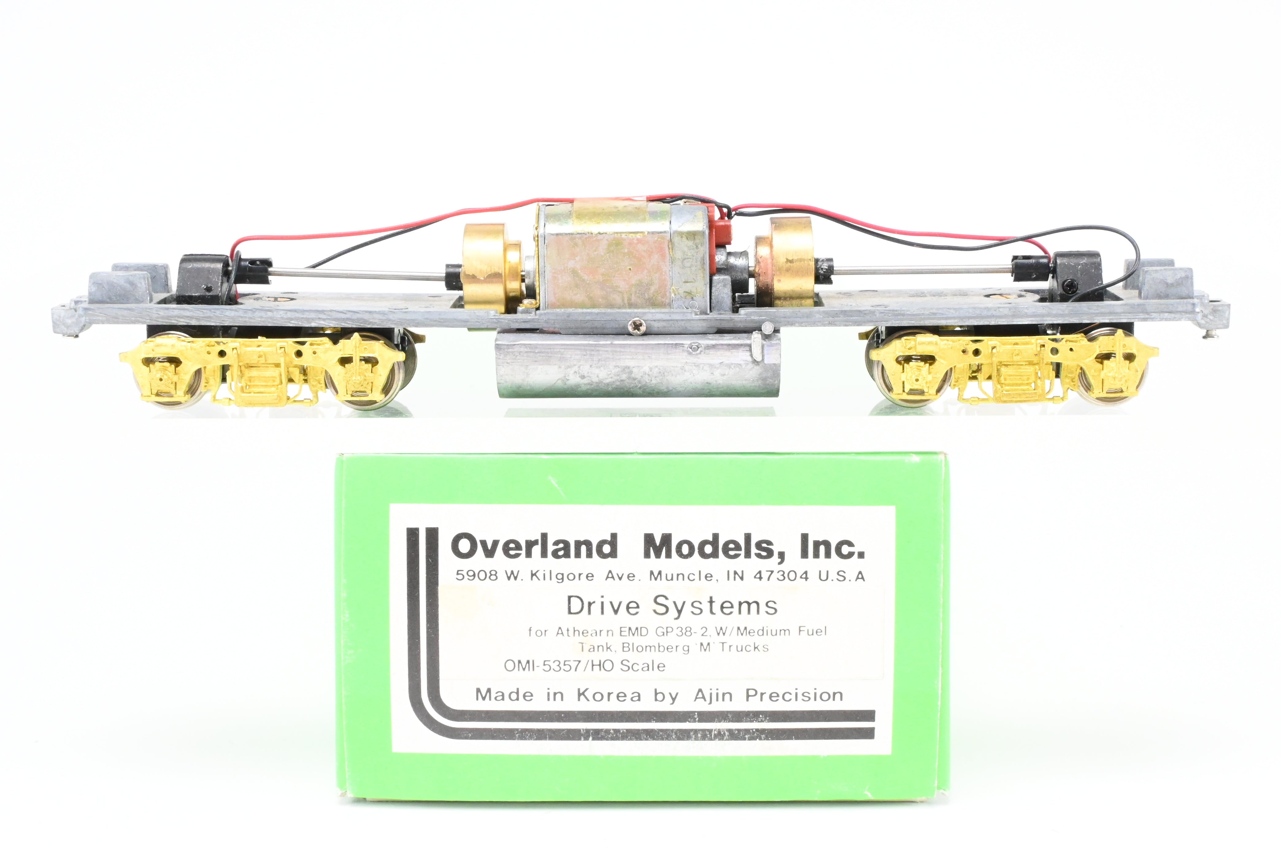 HO Scale Brass Model Train Drive Systems by Overland Models Inc. for EMD GP38-2 Locomotives with Blomberg M Trucks and Medium Fuel Tank - Various Road Configurations