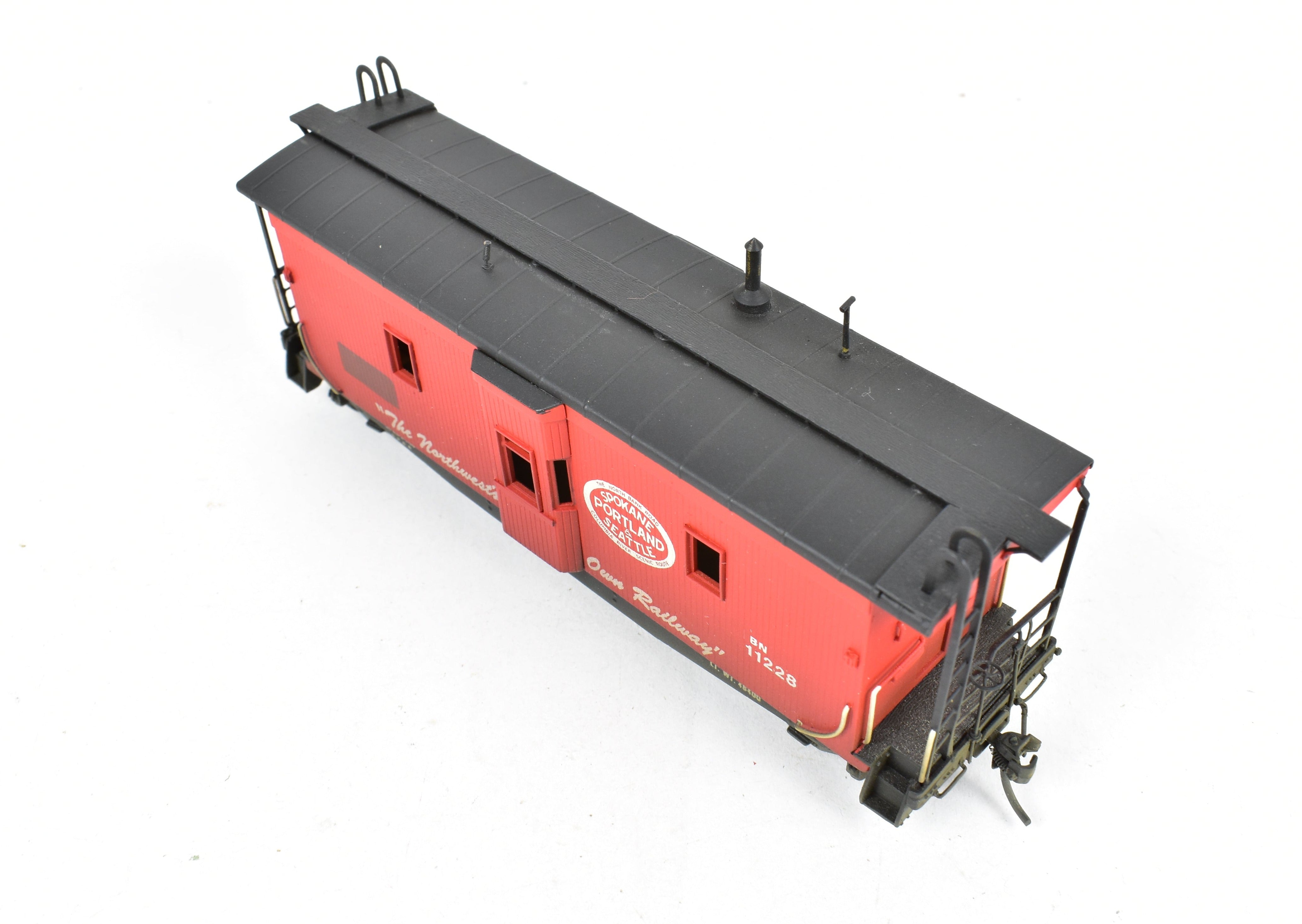 HO Scale Brass OMI - Overland Models, Inc. Model Train Spokane Portland & Seattle Wood Bay Window Caboose with Burlington Northern #11228 Design